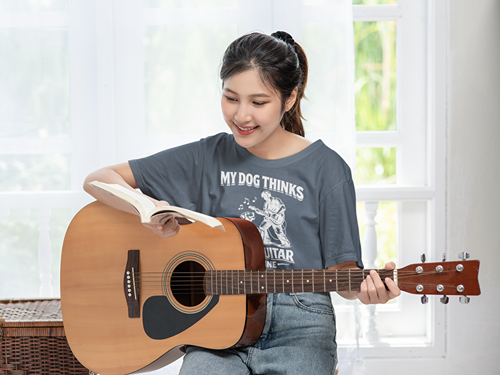 My Dog Thinks I Play Guitar Just Fine – Unisex Tee